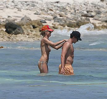 Heidi Klum caught topless on a beach in Mexico