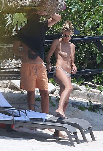 Heidi Klum caught topless on a beach in Mexico