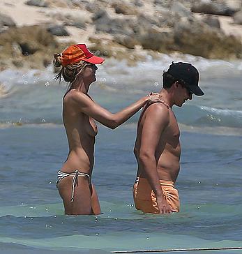 Heidi Klum caught topless on a beach in Mexico