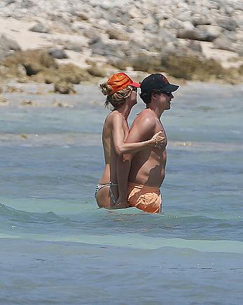 Heidi Klum caught topless on a beach in Mexico