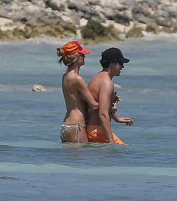 Heidi Klum caught topless on a beach in Mexico