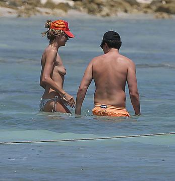 Heidi Klum caught topless on a beach in Mexico