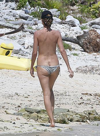 Heidi Klum caught topless on a beach in Mexico