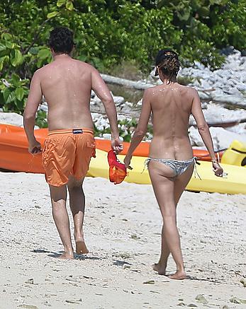 Heidi Klum caught topless on a beach in Mexico