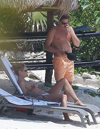 Heidi Klum caught topless on a beach in Mexico