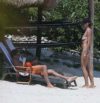 Heidi Klum caught topless on a beach in Mexico