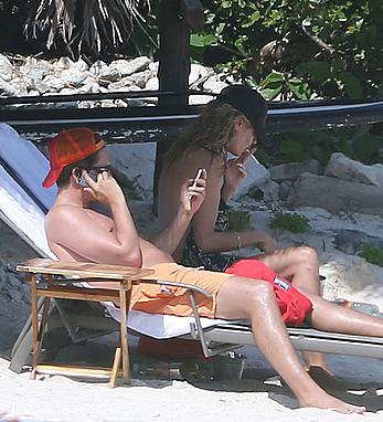 Heidi Klum caught topless on a beach in Mexico