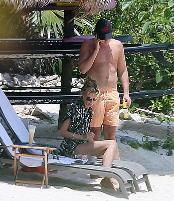 Heidi Klum caught topless on a beach in Mexico