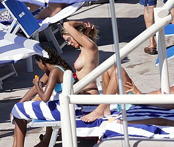 Heidi Klum topless on the beach in Capri