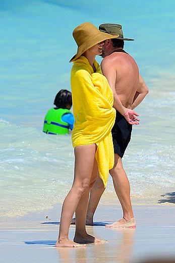 Heidi Klum wearing black bikini at a beach in the Bahamas