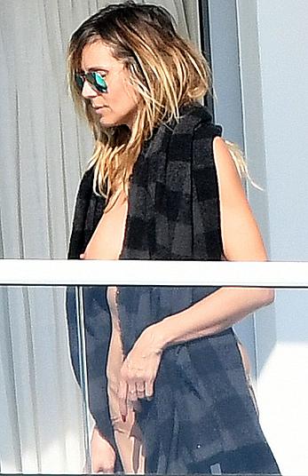 Heidi Klum topless on her hotel balcony in Miami