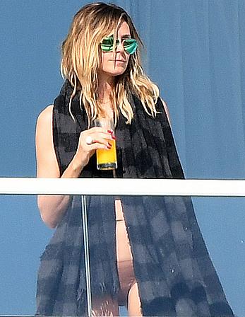 Heidi Klum topless on her hotel balcony in Miami