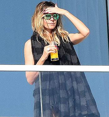 Heidi Klum topless on her hotel balcony in Miami