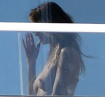 Heidi Klum topless on her hotel balcony in Miami