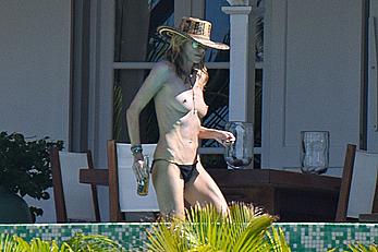 Heidi Klum topless in her hotel candids