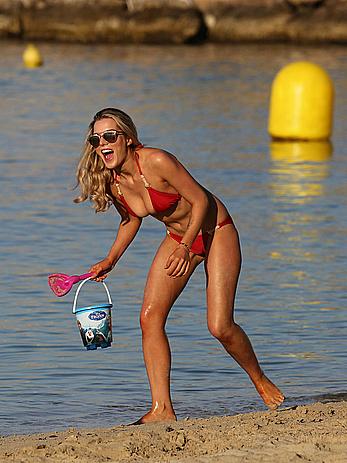 Helen Flanagan sexy in red bikini in a beach in Dubai