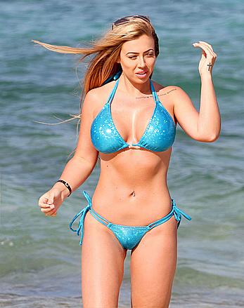 Holly Hagan in blue bikini on the beach in Ibizza