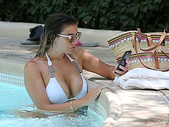 Busty Imogen Thomas relaxing in white bikini in the hot tub at her Las Vegas pool