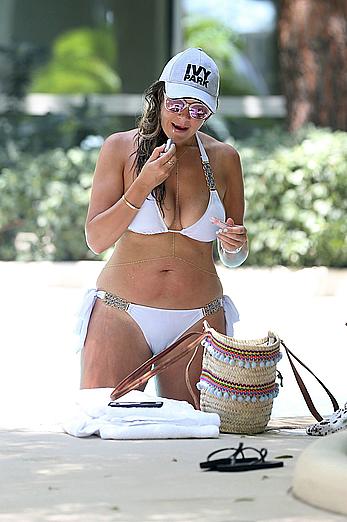 Busty Imogen Thomas relaxing in white bikini in the hot tub at her Las Vegas pool