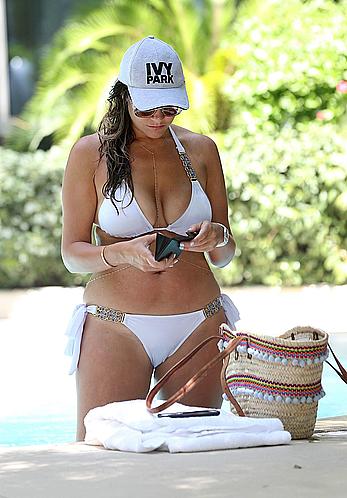 Busty Imogen Thomas relaxing in white bikini in the hot tub at her Las Vegas pool