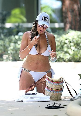 Busty Imogen Thomas relaxing in white bikini in the hot tub at her Las Vegas pool