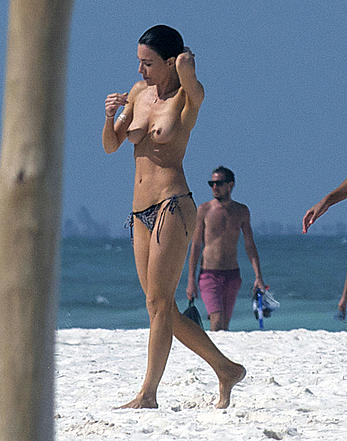 Jaime Murray caught topless at the beach in Mexico