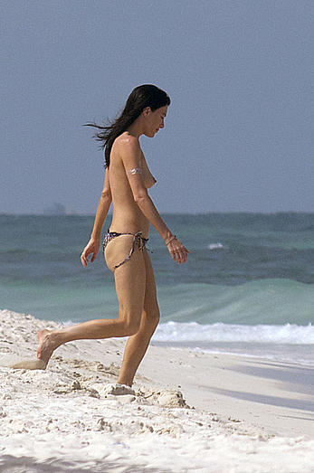 Jaime Murray caught topless at the beach in Mexico