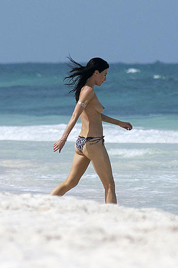 Jaime Murray caught topless at the beach in Mexico