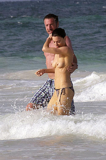 Jaime Murray caught topless at the beach in Mexico