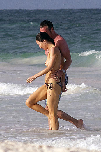 Jaime Murray caught topless at the beach in Mexico