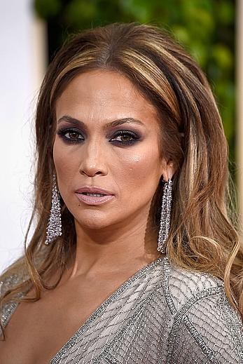 Jennifer Lopez llegs and sexy cleavage at 72nd Annual Golden Globe Awards