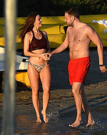 Jennifer Metcalfe pokies in wet bikini on a beach in Ibiza