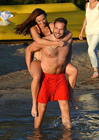 Jennifer Metcalfe pokies in wet bikini on a beach in Ibiza