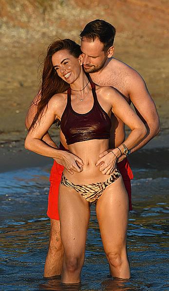 Jennifer Metcalfe pokies in wet bikini on a beach in Ibiza