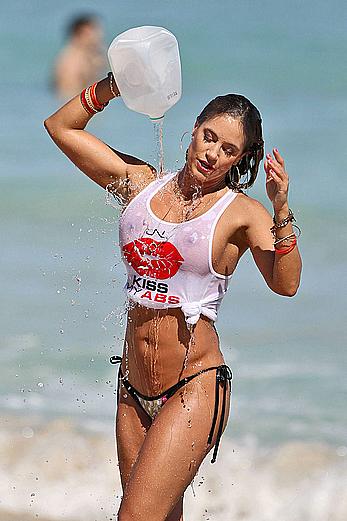 Jennifer Nicole Lee shows big boobs through wet transparent top on the beach in Miami