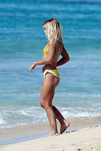 Jessica Woodley pokies in yellow bikini on the beach in Barbados