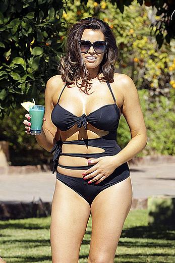 Jessica Wright nice cleavage in black bikini poolside shots