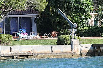 Joanna Krupa enjoying a sunny day in blue bikini at the pool in Miami Beach