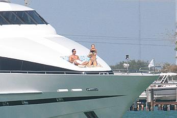 Joanna Krupa goes topless on a yacht in Miami