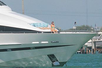 Joanna Krupa goes topless on a yacht in Miami