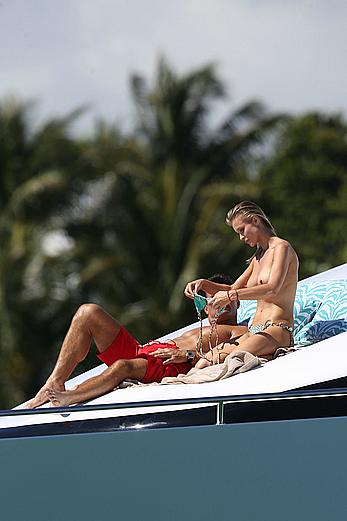 Joanna Krupa goes topless on a yacht in Miami