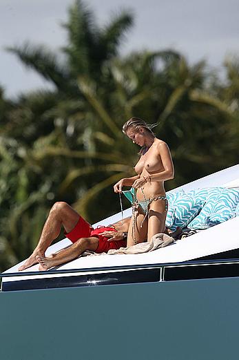 Joanna Krupa goes topless on a yacht in Miami