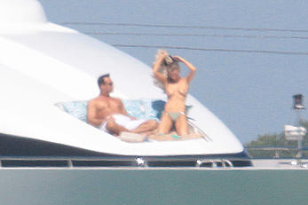 Joanna Krupa goes topless on a yacht in Miami