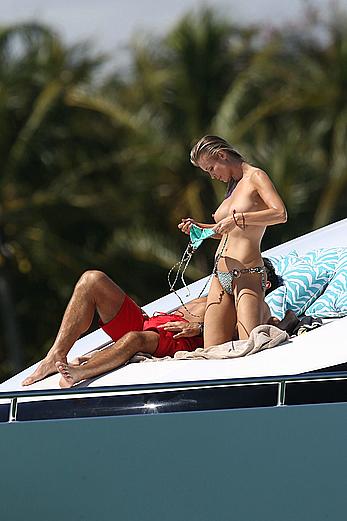 Joanna Krupa goes topless on a yacht in Miami