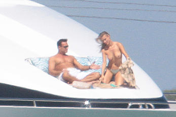 Joanna Krupa goes topless on a yacht in Miami