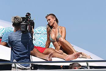 Joanna Krupa goes topless on a yacht in Miami