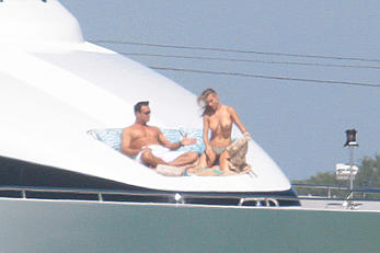 Joanna Krupa goes topless on a yacht in Miami