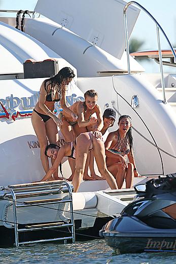 Joanna Krupa goes topless on a yacht in Miami