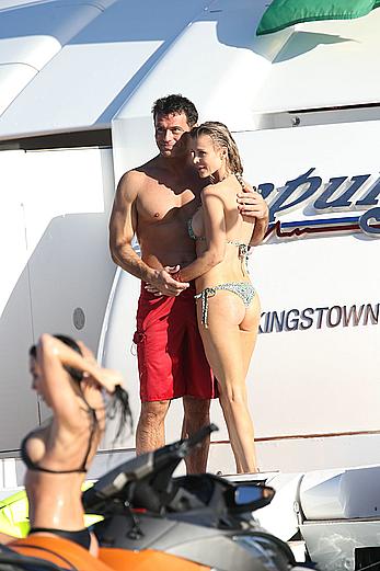 Joanna Krupa goes topless on a yacht in Miami