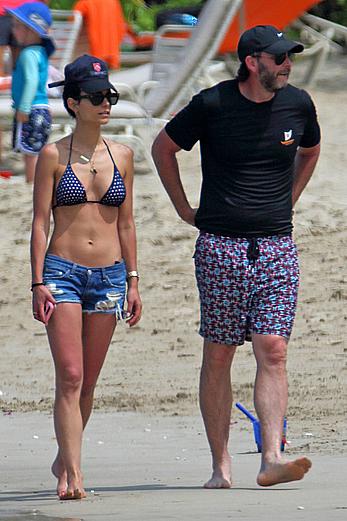 Jordana Brewster in bikini top and denim shorts at a beach in Hawaii